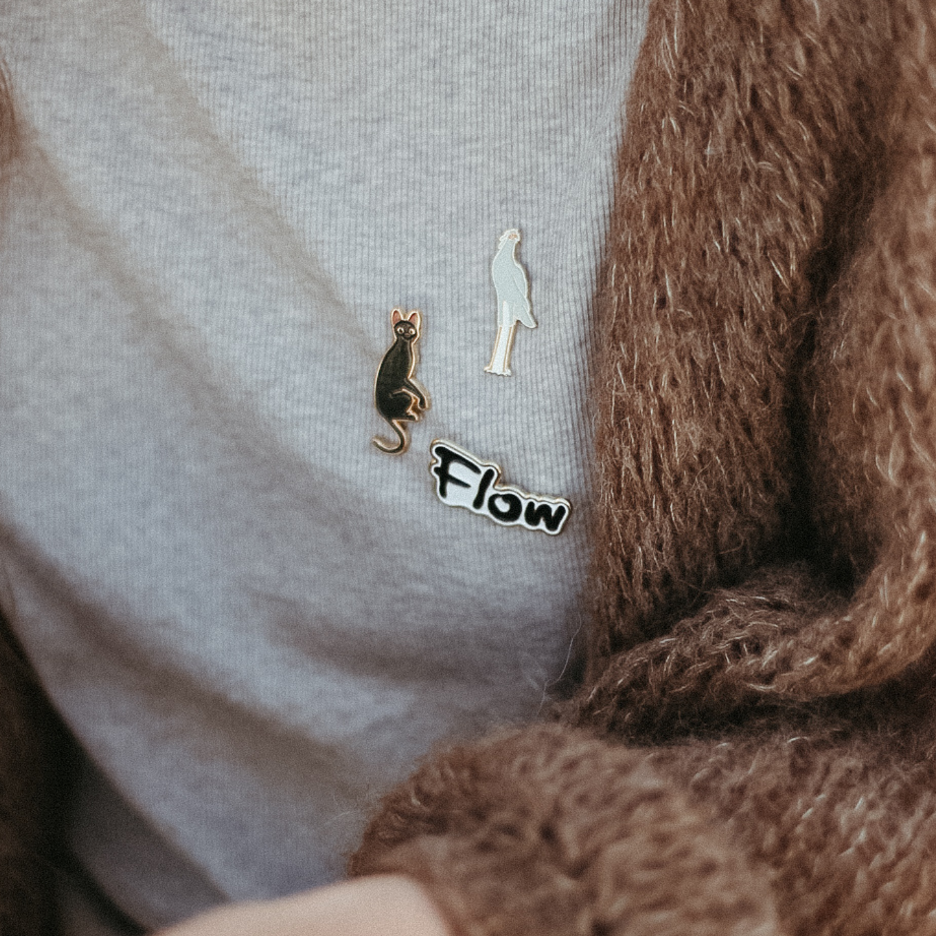 Flow x Manilla Official award-winning movie Flow merchandise. Limited edition Flow merch now ready for purchse.