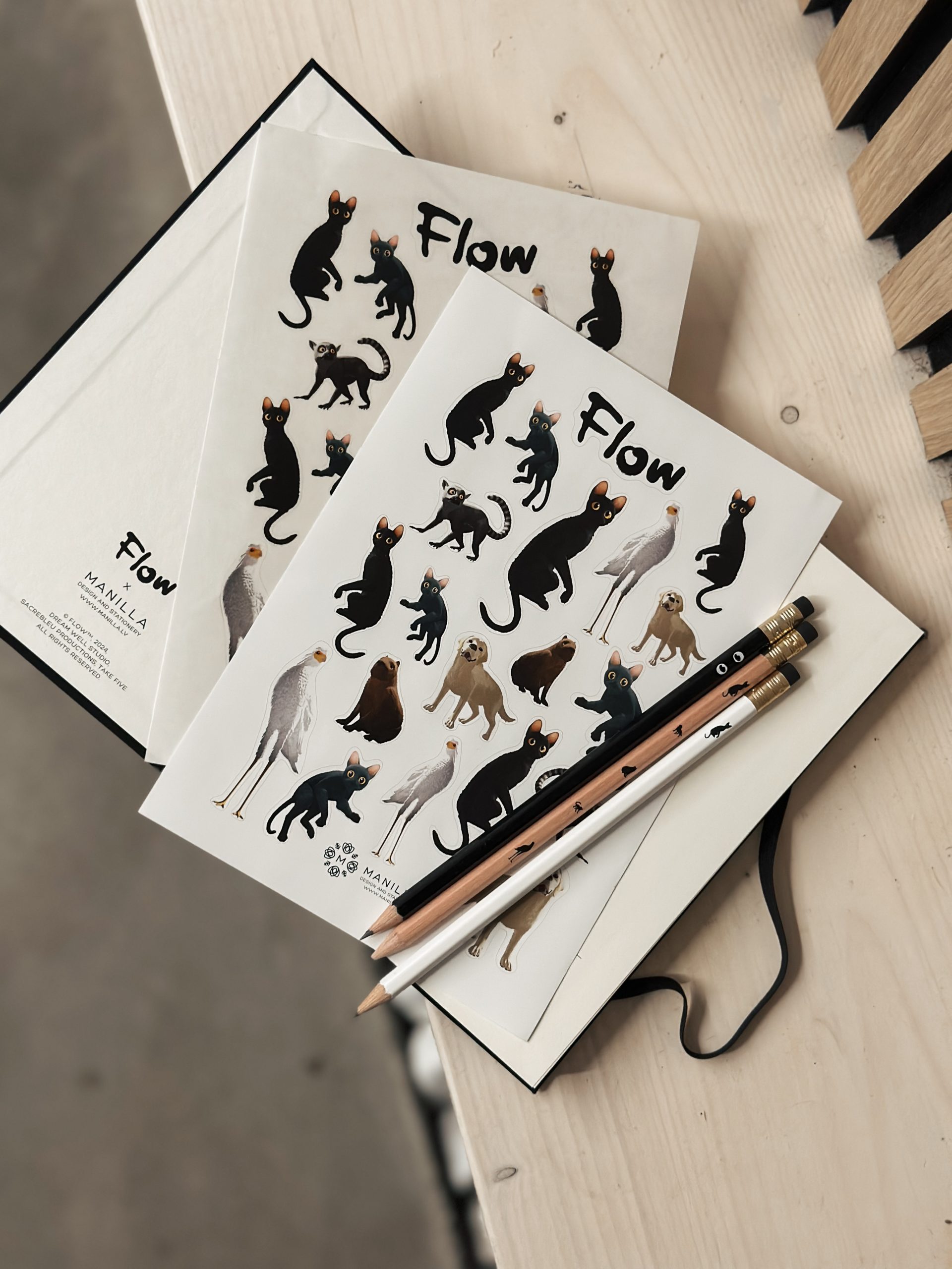 Flow x Manilla Official award-winning movie Flow merchandise. Limited edition Flow merch now ready for purchse.